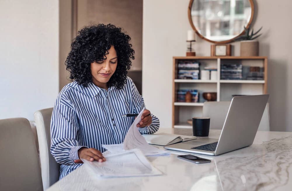 Woman working on laptop from home